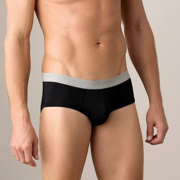 Man wearing black underwear with a gray waistband on a beige background