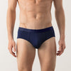 Man wearing navy blue underwear on a white background