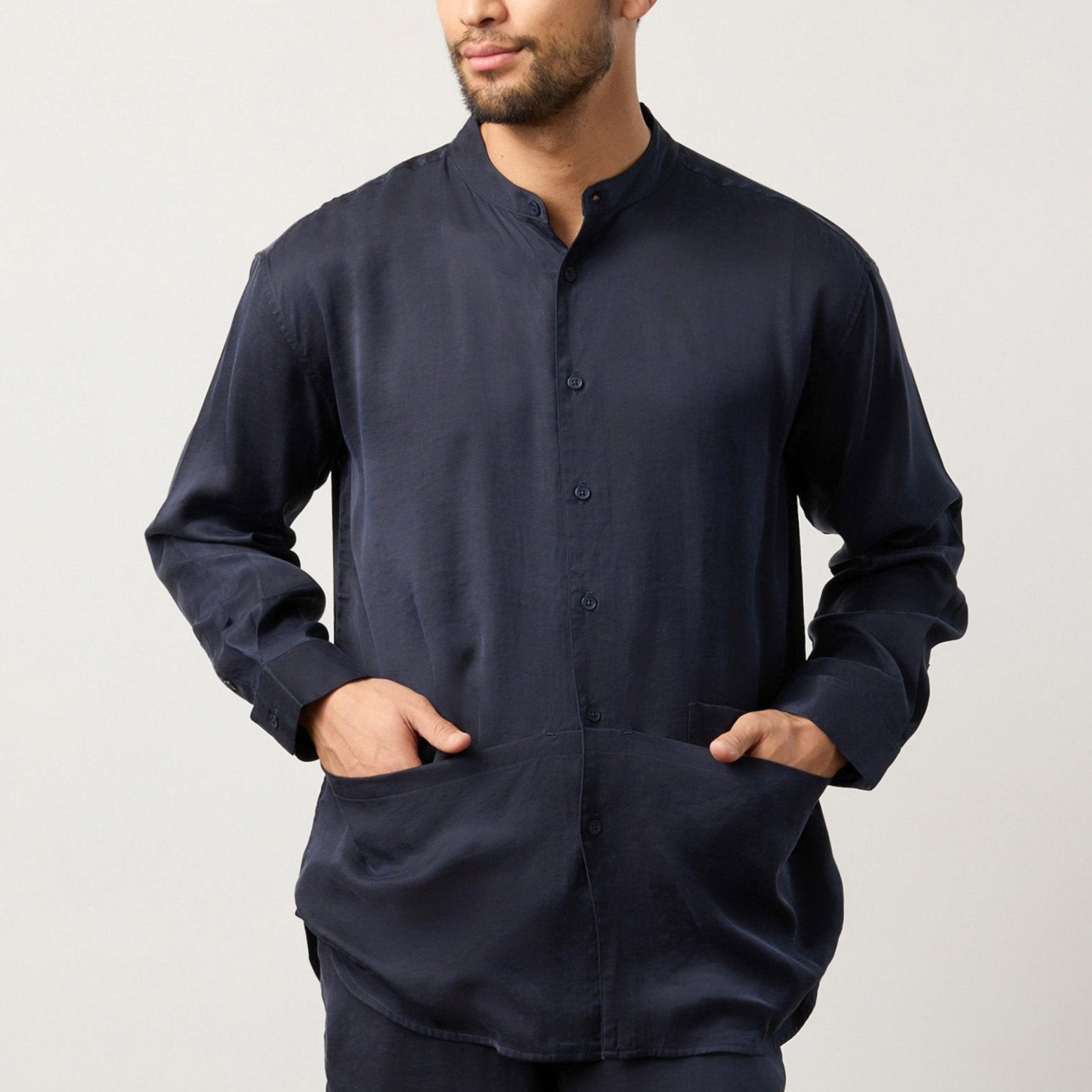 Flow TENCEL™ LUXE relaxed shirt with mandarin collar and front pockets in soft eucalyptus fabric.