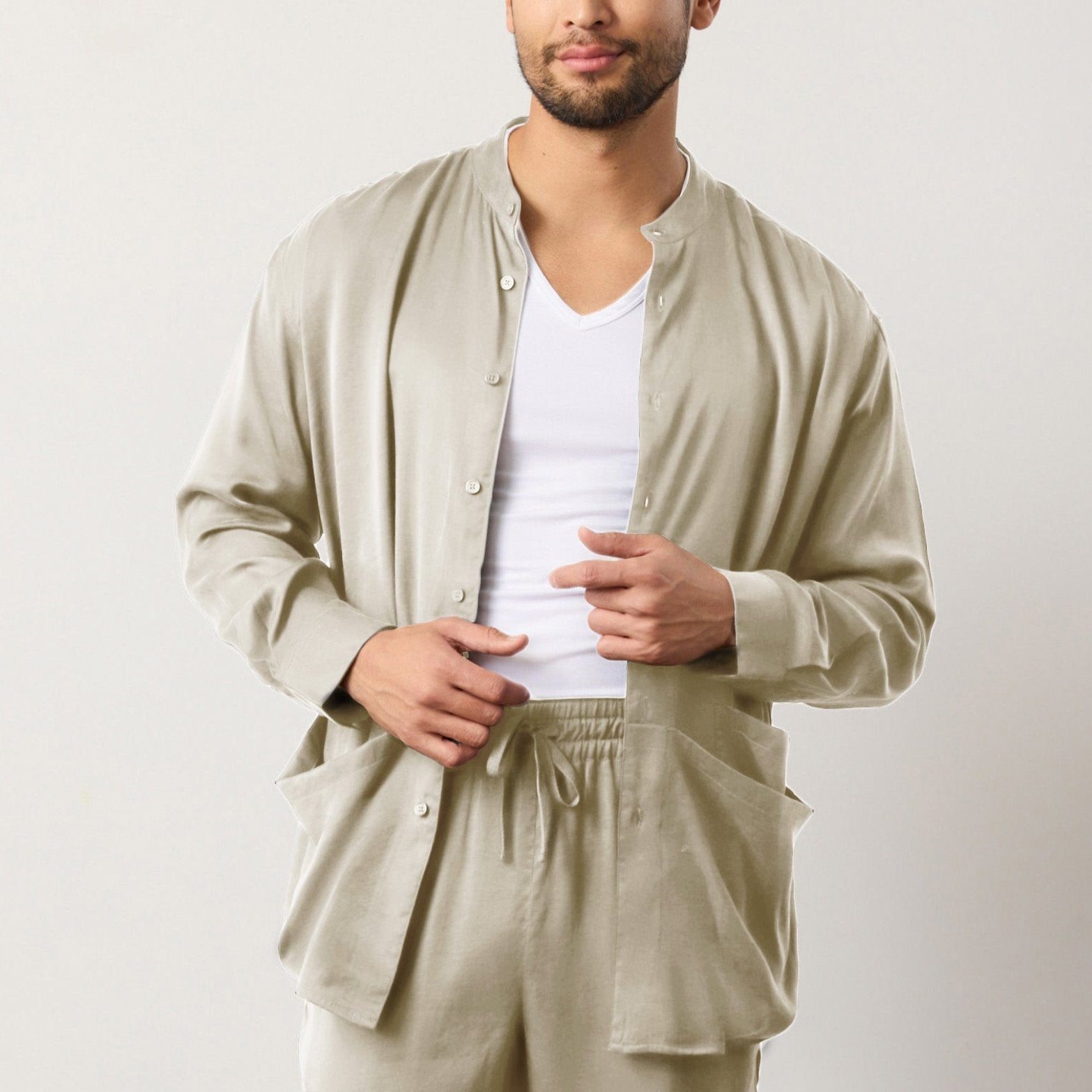 Flow TENCEL™ LUXE relaxed shirt with mandarin collar, front pockets, and soft pleats.