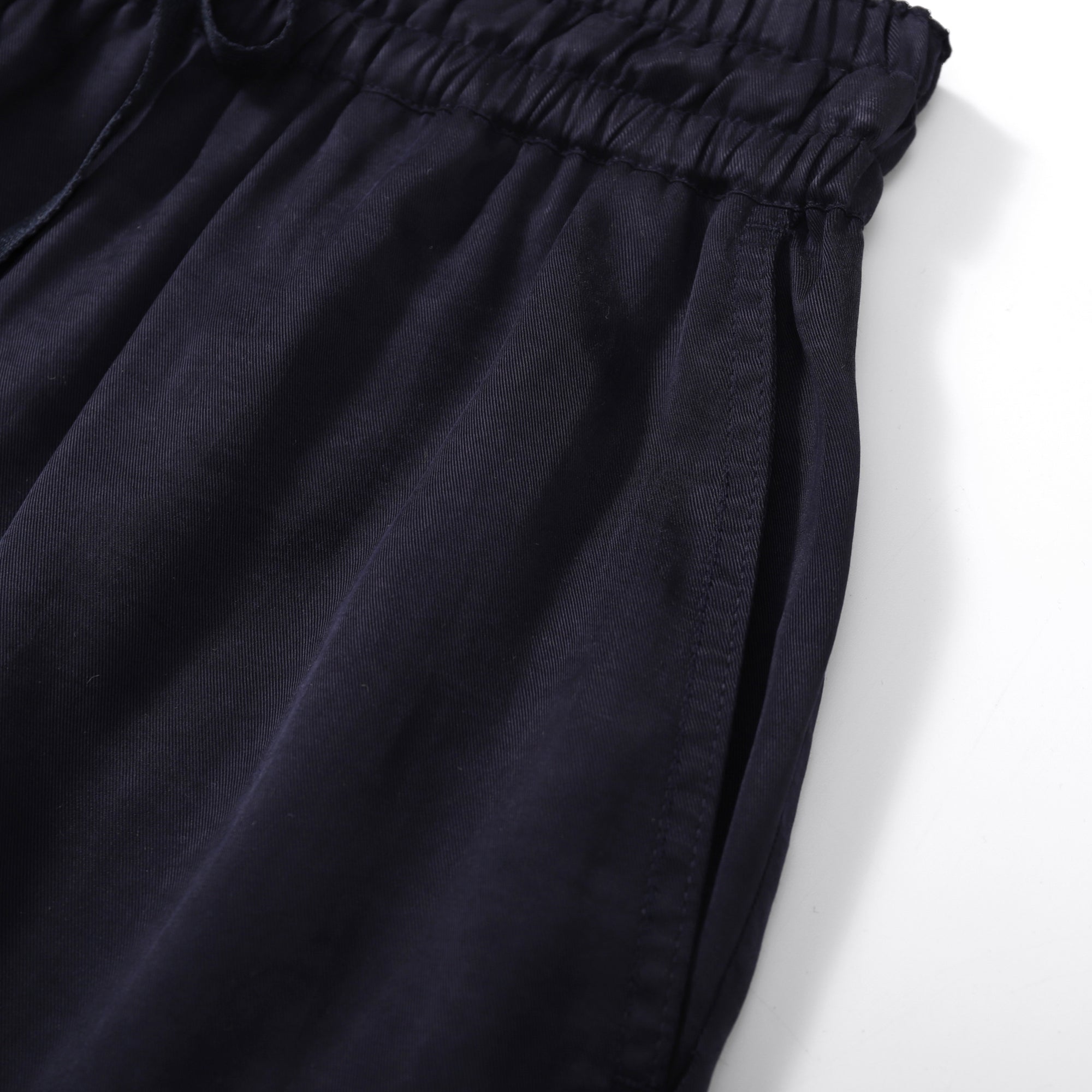 Flow TENCEL™ LUXE shorts with elastic waistband, eco-friendly, soft, and lightweight fabric.
