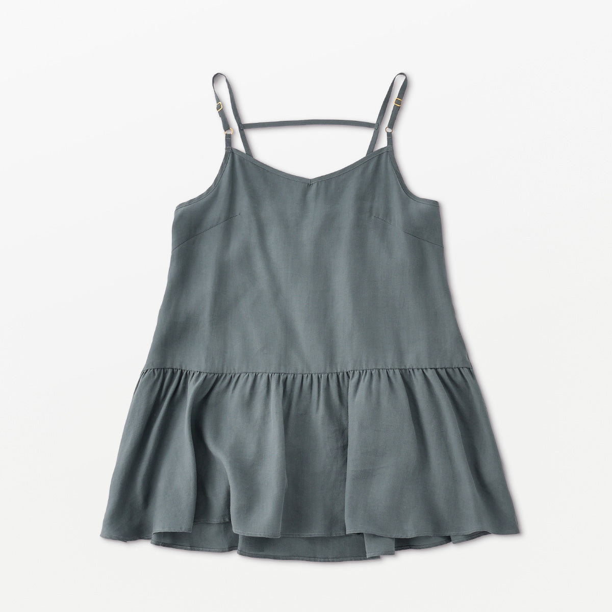 Flow TENCEL™ LUXE Peplum Top in relaxed style with adjustable straps, eco-friendly and elegant.